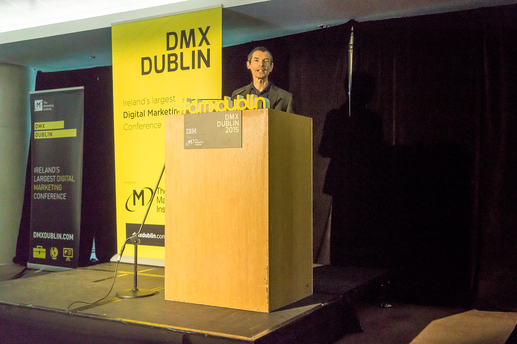 Speaker at a podium on stage at the DMX Dublin conference